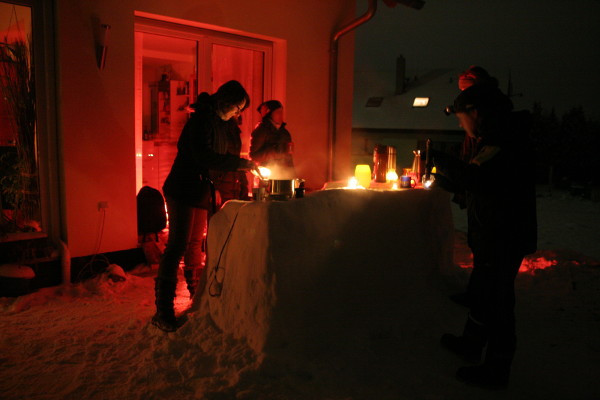 Manu with the neighbors at the snow bar.