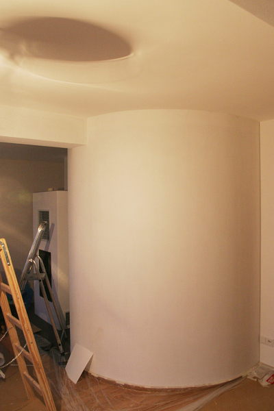 View of the round buffer wall in the living room with wallpaper